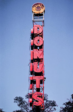 Photo Of A Giant Donuts Neon Sign - Art Print